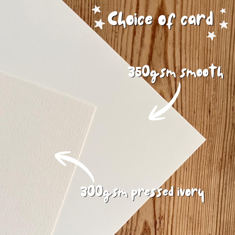 May include: Two sheets of cardstock with text reading Choice of card, 350gsm smooth, and 300gsm pressed ivory. One sheet is a smooth white cardstock, and the other is a textured ivory cardstock, both displayed for comparison of paper quality.