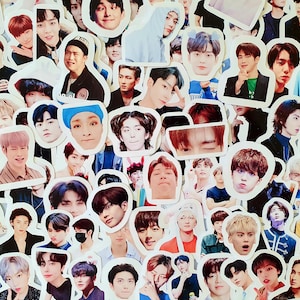 May include: A collection of colorful stickers featuring various images of men's faces. The stickers are printed on white paper and have a glossy finish.