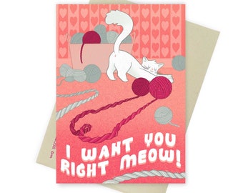 May include: A pink and white Valentine's Day card with a white cat playing with yarn balls. The card says "I want you right meow!"