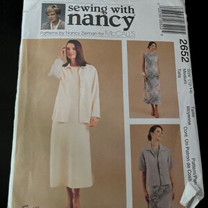 May include: Sewing pattern for a dress and jacket, size 12-14, by Nancy Zieman for McCall's. The pattern is labeled "Easy" and includes instructions for a dress and jacket.