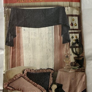 May include: A sewing pattern for a window treatment and table linens. The pattern is for a valance, curtains, and a tablecloth. The pattern is from Country Living Designs for Butterick and is called "Fast & Easy" and has the number 6820.