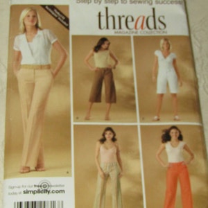 May include: Simplicity Threads Magazine Collection sewing pattern number 4135 for women's pants. The pattern includes five different styles of pants, including wide-leg, cropped, and cuffed.