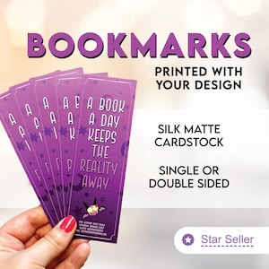 May include: Purple bookmarks with white text that reads "A book a day keeps the reality away." The bookmarks are printed with your design on silk matte cardstock and are available single or double sided.