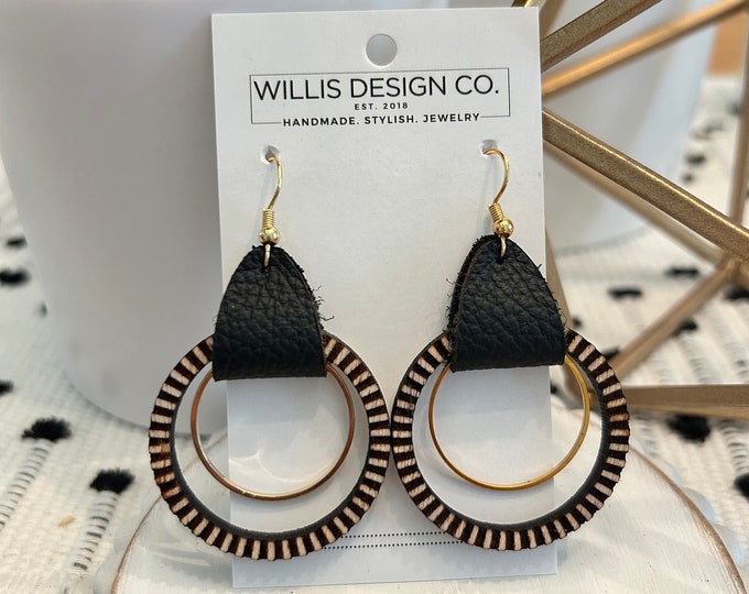 Black leather with wooden engraved circle and gold accent hoop