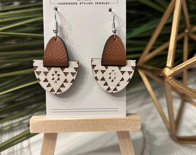 White wooden aztec pattern with brown leather accent