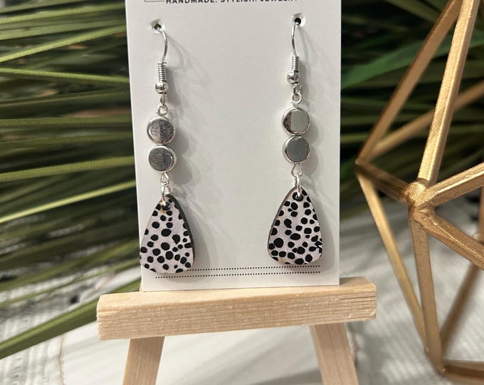 grey and black dotted wooden earrings with silver accent