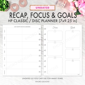 May include: An undated HP Classic disc planner, 7x9.25 inches, with sections for recap, focus, and goals. The planner has a white background with black text and a spiral binding. Includes sections for family, friends, home, work, health, fun, and finances.
