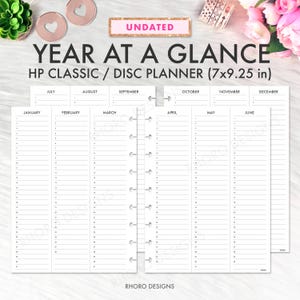 May include: Undated HP Classic/Disc Planner with a "Year at a Glance" layout. The planner measures 7x9.25 inches and features monthly sections from January to December. The design includes a white background with black text and a disc-bound binding.