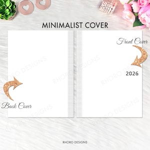 May include: A minimalist white notebook cover design with the text "MINIMALIST COVER". The front and back covers are indicated with gold glitter arrows. The spine features a gray grid pattern. The year "2026" is printed on the front cover. The brand name "RHORO DESIGNS" is at the bottom.