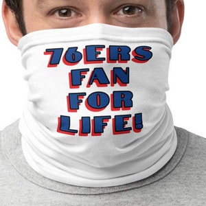 May include: White neck gaiter with the text "76ers Fan For Life!" in blue and red lettering.