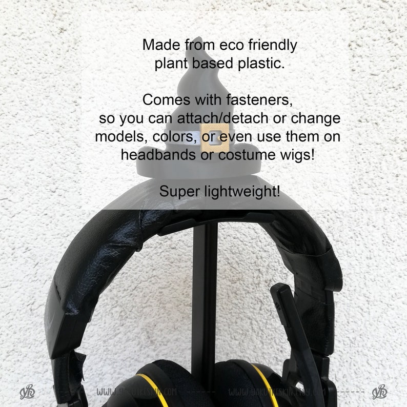May include: Black headphones with yellow accents are hanging on a black stand. The headphones are made from eco-friendly plant-based plastic and come with fasteners to attach or detach them. The text "Super lightweight!" is visible in the image.
