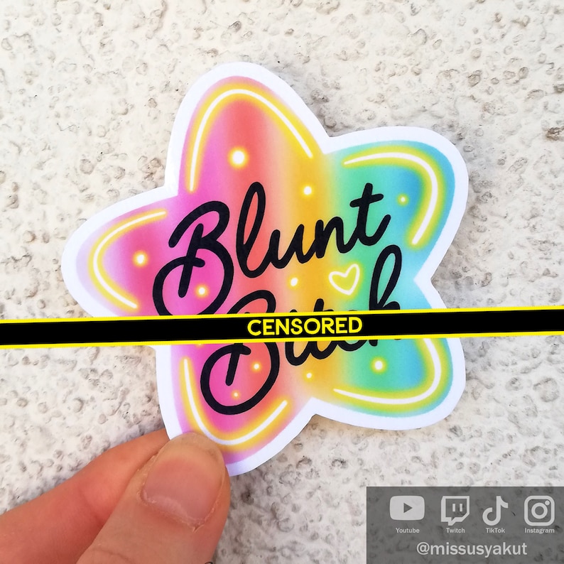 May include: A rainbow star-shaped sticker with the text "Blunt [CENSORED]" in black. The sticker has a neon glow effect.