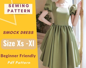 May include: A sewing pattern for a smock dress in sizes XS-XL. The pattern is beginner friendly and comes in a PDF format. The image shows a model wearing a green smock dress.
