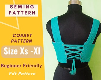 May include: A turquoise blue corset sewing pattern with a lace-up back. The pattern is for sizes XS-XL and is beginner friendly. The pattern is available as a PDF download.