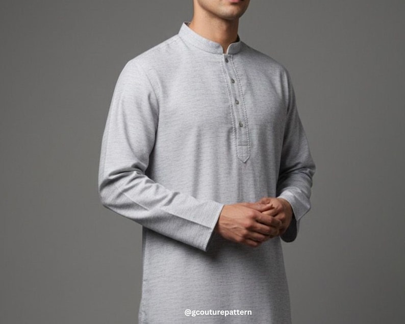May include: A light gray long-sleeved tunic with a mandarin collar and buttoned placket. The tunic has a textured appearance and is made of a soft fabric. The sleeves have buttoned cuffs. The bottom right corner of the image has the text "@gcouturepattern".