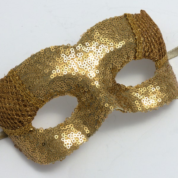 Masque de mascarade à paillettes dorées avec maille lurex. Masque de déguisement idéal pour les enterrements de vie de jeune fille, les bals, les événements élégants, les festivals de musique, les bals.