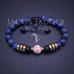 Matte Sodalite & Red Line Jasper Bracelet. Adjustable Size w/ 8mm Beads, Non-Tarnish Stainless Steel Charms In Gold, Silver, and Blue Tones
