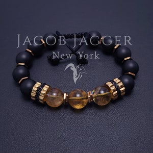 Bracelet de luxe en citrine dorée et onyx noir mat pour homme/femme. Réglable avec des perles de pierre de 10 mm et des entretoises en acier inoxydable doré.