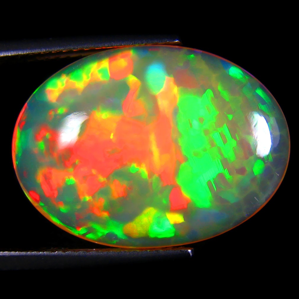 10.28 ct Super-Excellent Oval Cabochon (21 x 16 mm) Flashing 360 Degree Multicolor Rainbow Opal Loose Gemstonethumbnail