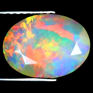 1.82 ct Excellent Oval (11 x 9 mm) Ethiopian 360 Degree Flashing Rainbow Opal Genuine Loose Gemstone