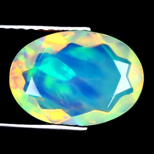 1.81 ct Incredible Oval (12 x 8 mm) Ethiopian 360 Degree Flashing Rainbow Opal Genuine Loose Gemstone