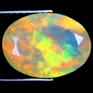 2.22 ct Excellent Oval (12 x 9 mm) Ethiopian 360 Degree Flashing Rainbow Opal Genuine Loose Gemstone