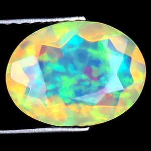 1.34 ct Terrific Oval (10 x 8 mm) Ethiopian 360 Degree Flashing Rainbow Opal Genuine Loose Gemstone