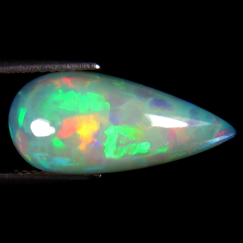 Ethiopian 360 Degree Flashing Rainbow Opal Natural Loose Gemstone video link in description 5.68 ct Marvelous Pear Cabochon 20 x 9 mm