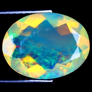 2.19 ct Very good Oval (12 x 9 mm) Ethiopian 360 Degree Flashing Rainbow Opal Genuine Loose Gemstone