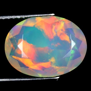 3.51 ct Phenomenal Oval (14 x 11 mm) Untreated and Unheated Transparent Quality Ethiopian Rainbow Opal Natural and Genuine Loose Gemstone
