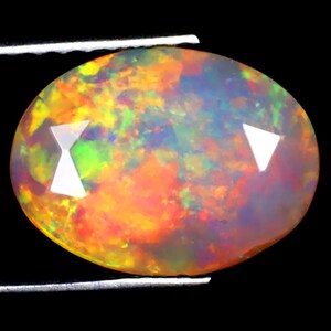 1.94 ct Terrific Oval (11 x 8 mm) Ethiopian 360 Degree Flashing Rainbow Opal Genuine Loose Gemstone