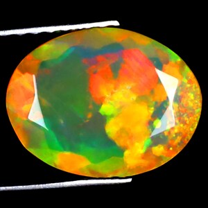 1.68 ct Shimmering Oval (11 x 9 mm) Ethiopian 360 Degree Flashing Rainbow Opal Genuine Loose Gemstone
