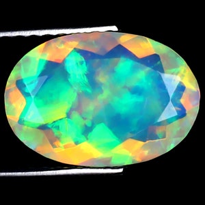 1.73 ct Very good Oval (12 x 8 mm) Ethiopian 360 Degree Flashing Rainbow Opal Genuine Loose Gemstone