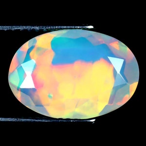 2.74 ct Incredible Oval (14 x 10 mm) Untreated and Unheated Transparent Quality Ethiopian Rainbow Opal Natural and Genuine Loose Gemstone