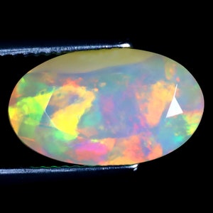 3.90 ct Outstanding Oval (15 x 9 mm) Untreated and Unheated Transparent Quality Ethiopian Rainbow Opal Natural and Genuine Loose Gemstone