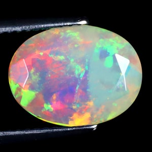 2.61 ct Grand looking Oval (12 x 9 mm) Untreated and Unheated Transparent Quality Ethiopian Rainbow Opal Natural and Genuine Loose Gemstone