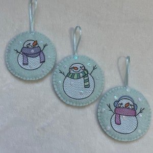 Embroidered snowmen decorations