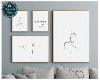 May include: Four framed prints with minimalist line drawings of yoga poses. The prints are hung on a light blue wall. The prints have white mats and black frames. The text on the prints reads "Believe", "Courage", "Uplift", and "Ground".