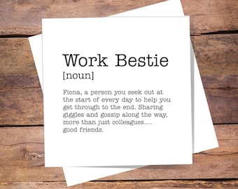 May include: A square white greeting card featuring black text that defines the term Work Bestie as a noun. The text reads: Fiona, a person you seek out at the start of every day to help you get through to the end. Sharing giggles and gossip along the way, more than just colleagues.... good friends.