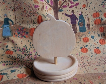 Unfinished basswood pumpkin on a stand, ready to paint or carve