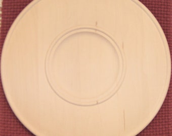 16-inch wide rimmed plate.  Hand turned in basswood.  Ready to Paint!