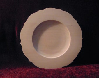10-inch unfinished, hand turned, basswood plate.  Rim is flat with a scalloped edge.  Ready to paint!