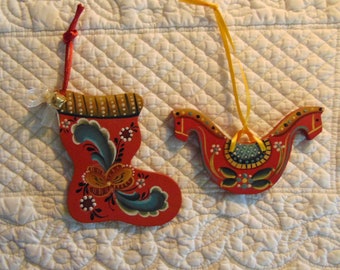 Two Rosemaled ornaments painted by Jan in the Hallingdal style.