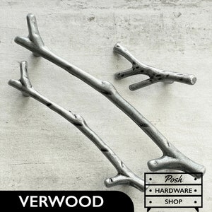 May include: Three silver metal cabinet knobs shaped like branches. The knobs are in various sizes and have a rustic, natural look. The text "VERWOOD" and "Posh Hardware Shop" is visible in the image.