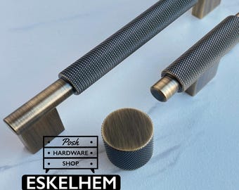 May include: Two antique brass cabinet pulls and one matching round knob featuring a textured, diamond-patterned knurled grip. The hardware includes a logo graphic with the text Posh HARDWARE SHOP and the word ESKELHEM printed in white on a black background.