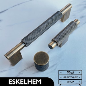 May include: Three antique brass cabinet knobs with a textured, diamond-shaped pattern. The knobs are in various sizes and are ideal for adding a touch of vintage style to any home decor project.