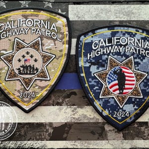 May include: Two embroidered patches with a camouflage pattern. The patches are shaped like a shield and feature the text "CALIFORNIA HIGHWAY PATROL" and the year "2024". One patch is in a desert camouflage pattern and the other is in a blue camouflage pattern.