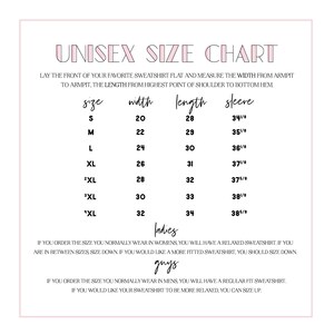 May include: A white and pink Unisex Size Chart with measurements for sweatshirts. Sizes range from S to 4XL, with width measurements from 20 to 32 inches, and lengths from 28 to 34 inches. Sleeve measurements are also provided.