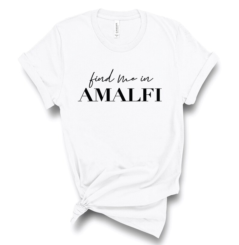 May include: White t-shirt with black text that reads "find me in AMALFI"