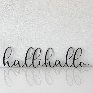 Lettering "hallihallo" made of stainless steel, powder-coated in black